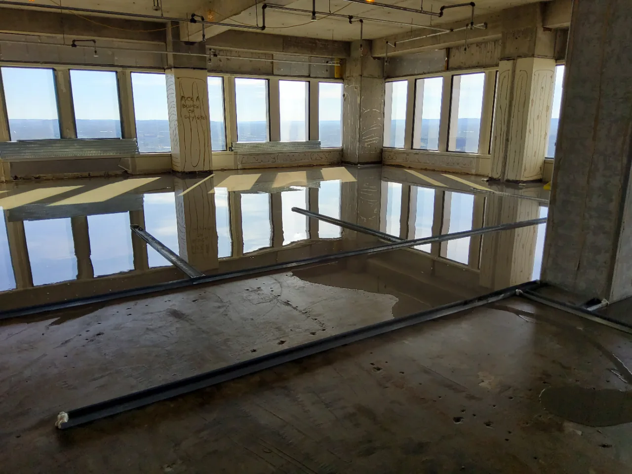 Cured, flat self-leveling underlayment across an open office floor at 500 West, Louisville