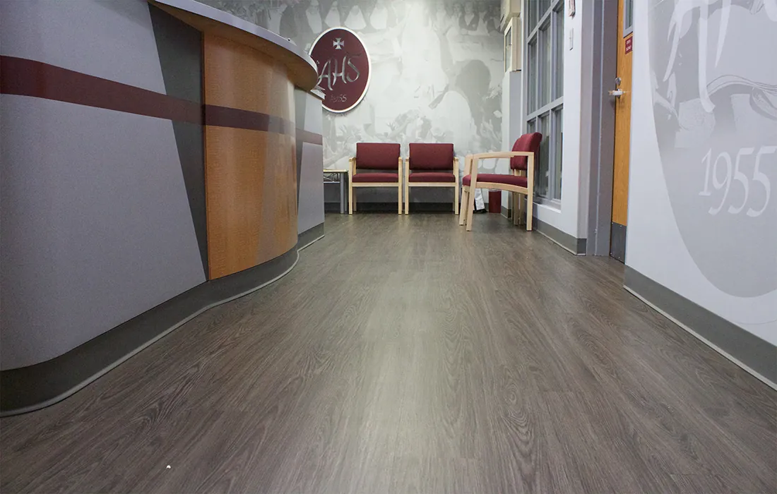 Commercial luxury vinyl plank in the front office at Assumption High School, Louisville